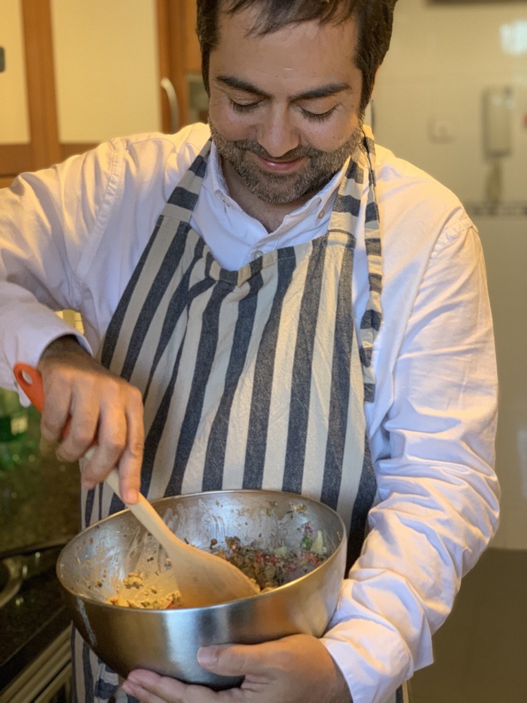 René Dechamps Otamendi cooking in the kitchen